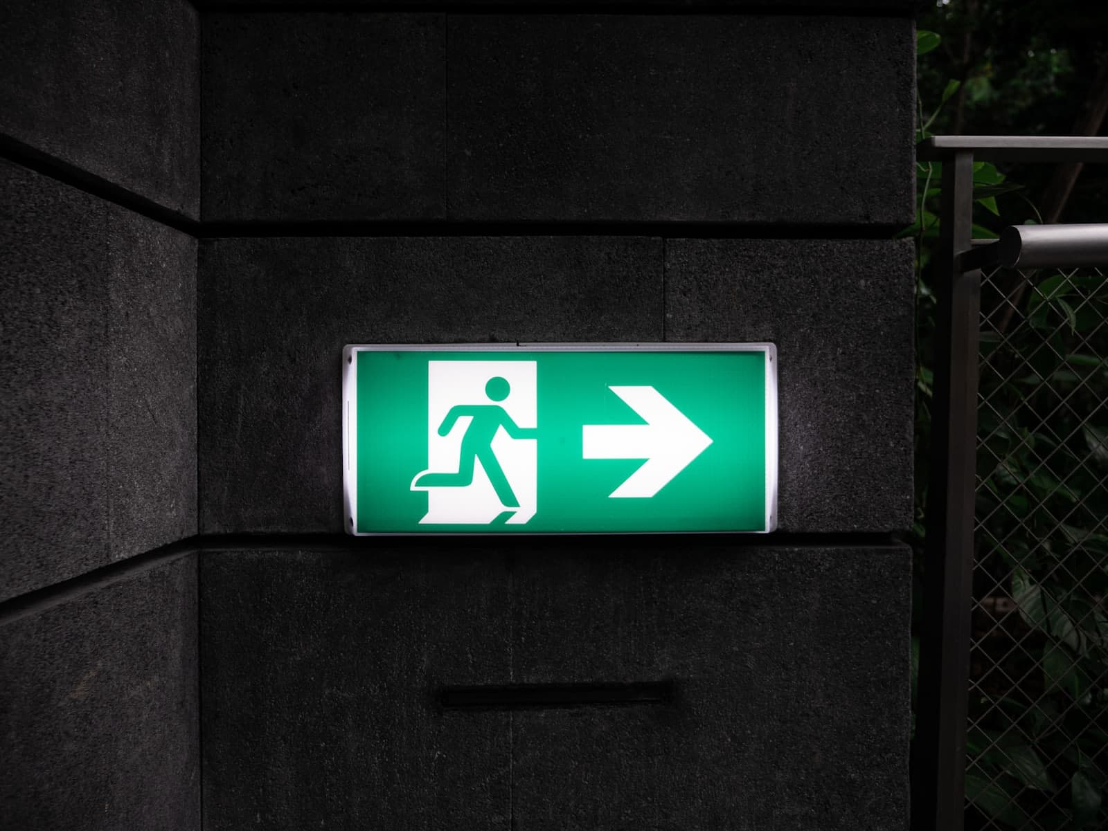 White and green Exit sign